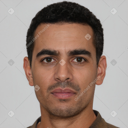 Neutral latino young-adult male with short  black hair and brown eyes