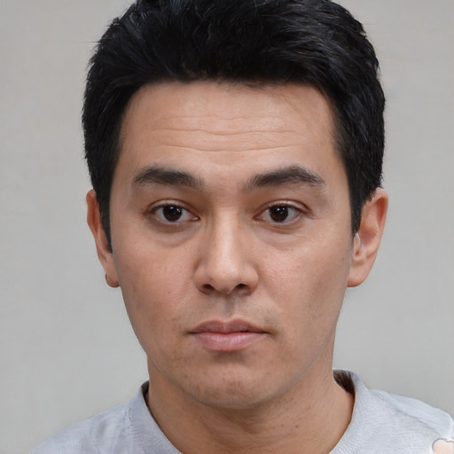 Neutral white young-adult male with short  black hair and brown eyes