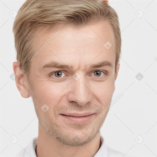 Joyful white adult male with short  brown hair and grey eyes