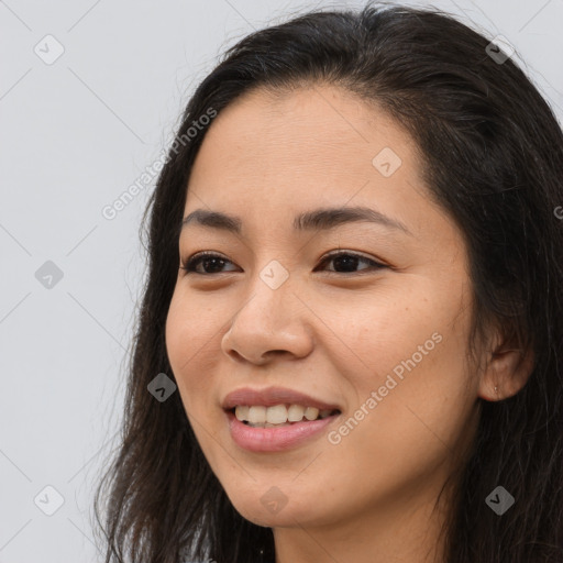 Joyful asian young-adult female with long  brown hair and brown eyes