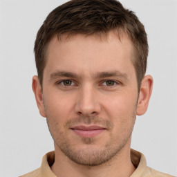 Joyful white young-adult male with short  brown hair and brown eyes