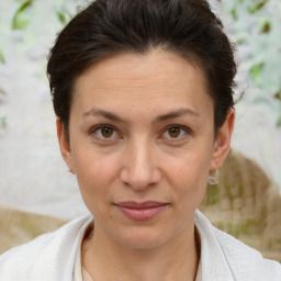 Joyful white adult female with short  brown hair and brown eyes