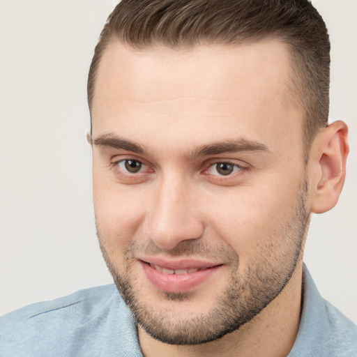 Joyful white young-adult male with short  brown hair and brown eyes