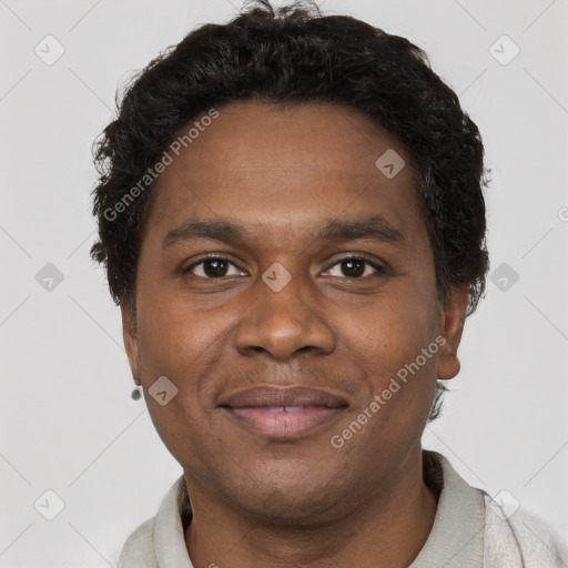 Joyful black young-adult male with short  brown hair and brown eyes