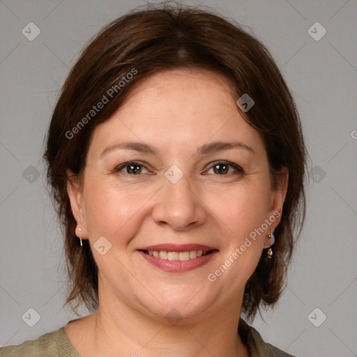 Joyful white adult female with medium  brown hair and brown eyes