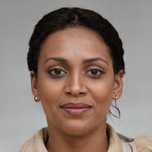 Joyful latino young-adult female with short  brown hair and brown eyes