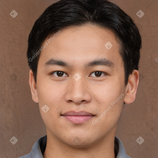 Joyful asian young-adult male with short  brown hair and brown eyes