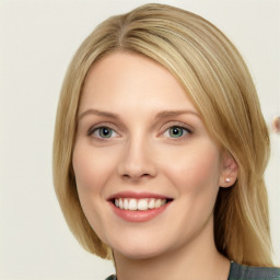 Joyful white young-adult female with long  brown hair and blue eyes