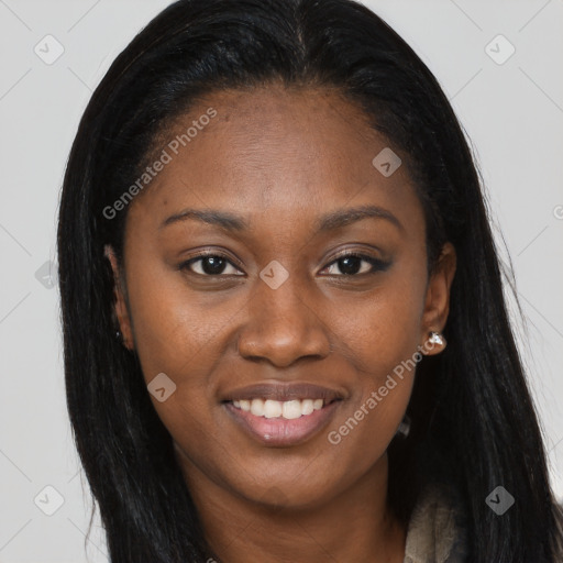 Joyful black young-adult female with long  brown hair and brown eyes