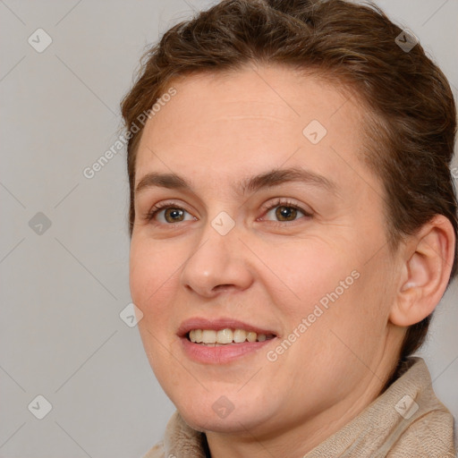 Joyful white adult female with short  brown hair and brown eyes