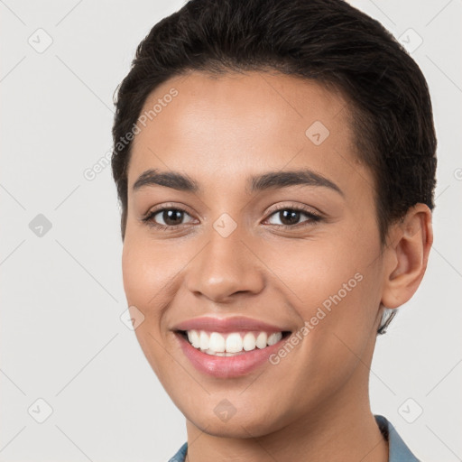 Joyful white young-adult female with short  brown hair and brown eyes