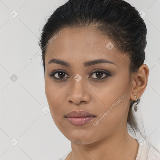 Joyful latino young-adult female with long  brown hair and brown eyes