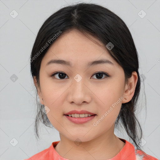 Joyful asian young-adult female with medium  black hair and brown eyes