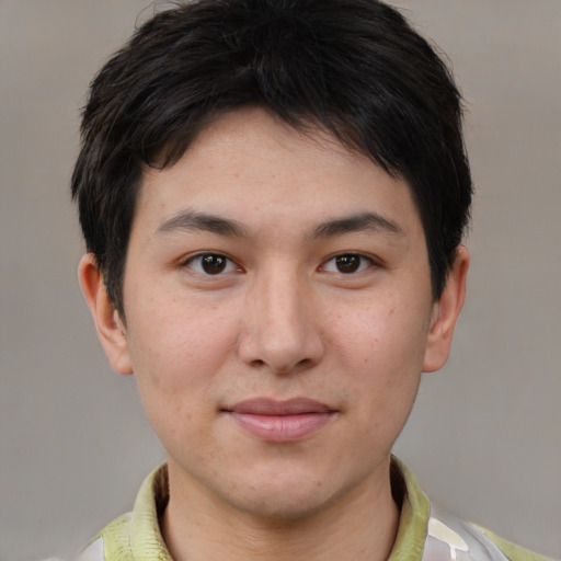 Joyful asian young-adult male with short  brown hair and brown eyes