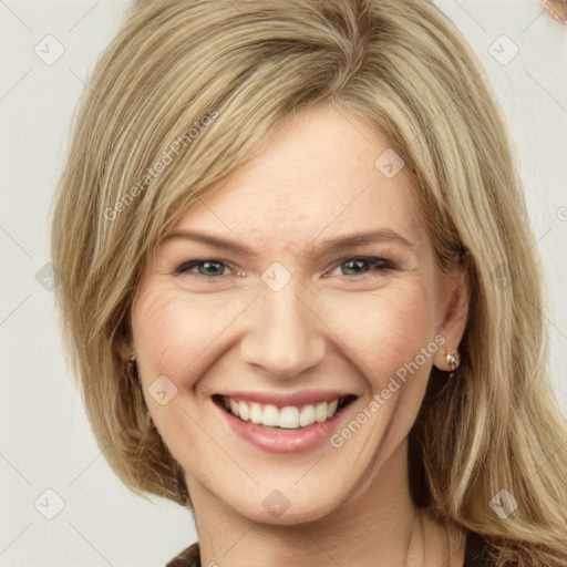 Joyful white young-adult female with medium  brown hair and green eyes