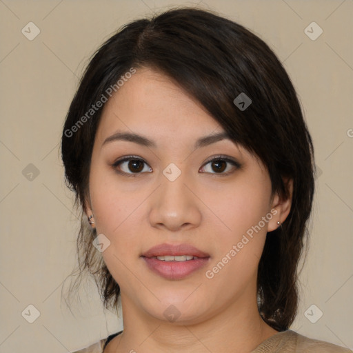 Joyful latino young-adult female with medium  brown hair and brown eyes