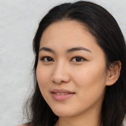 Joyful asian young-adult female with long  brown hair and brown eyes