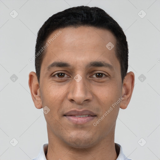 Joyful latino young-adult male with short  black hair and brown eyes