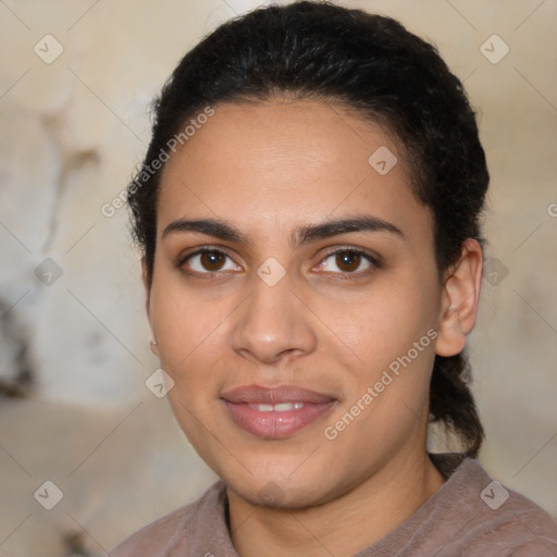 Joyful latino young-adult female with short  brown hair and brown eyes