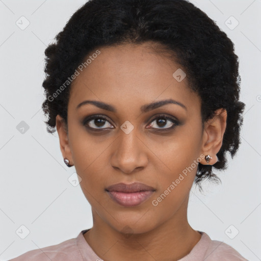 Joyful black young-adult female with short  black hair and brown eyes