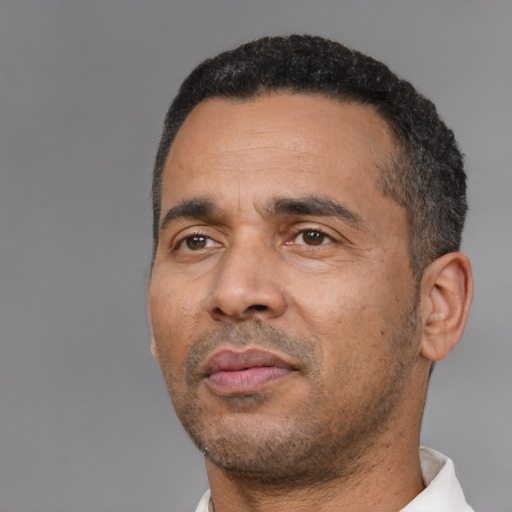 Neutral black adult male with short  black hair and brown eyes