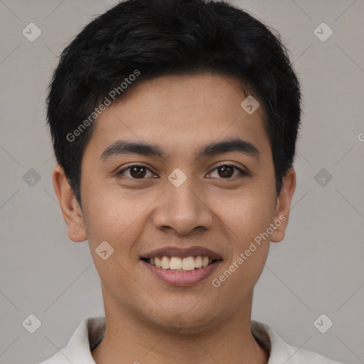 Joyful latino young-adult male with short  brown hair and brown eyes