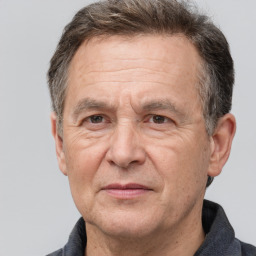 Joyful white middle-aged male with short  brown hair and brown eyes