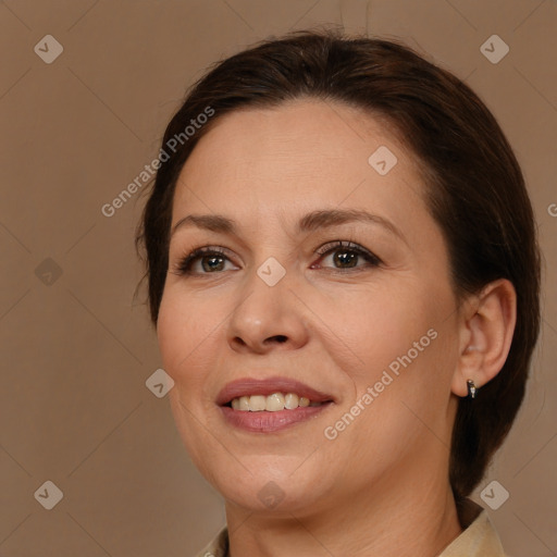 Joyful white adult female with medium  brown hair and brown eyes