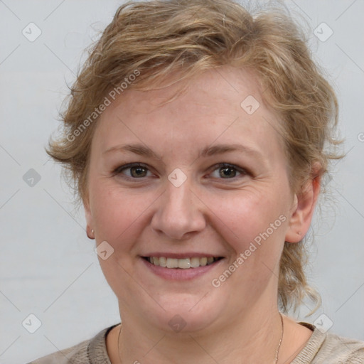 Joyful white young-adult female with medium  brown hair and blue eyes