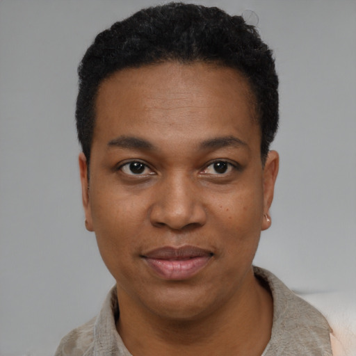 Joyful black young-adult female with short  black hair and brown eyes