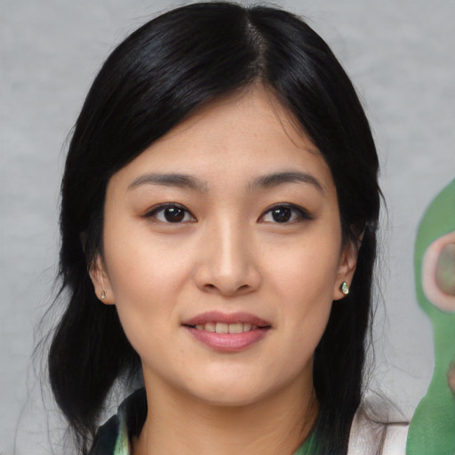Joyful white young-adult female with medium  black hair and brown eyes