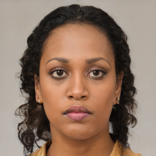 Neutral black young-adult female with long  brown hair and brown eyes