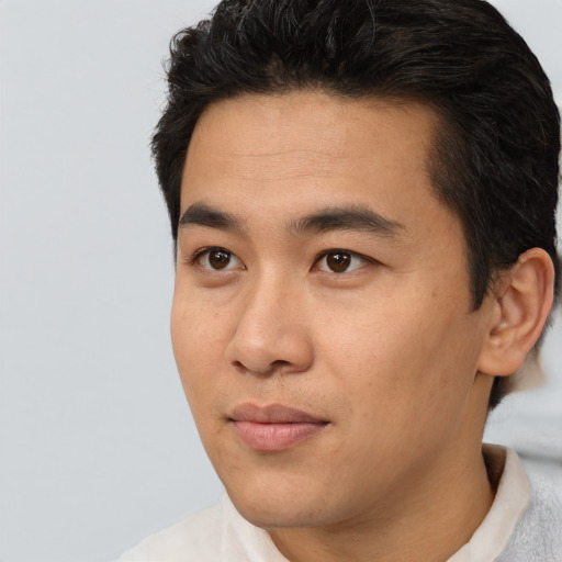 Neutral asian young-adult male with short  black hair and brown eyes