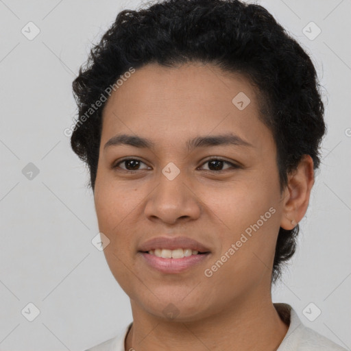 Joyful latino young-adult female with short  black hair and brown eyes