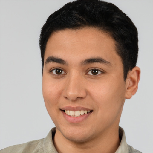 Joyful white young-adult male with short  black hair and brown eyes