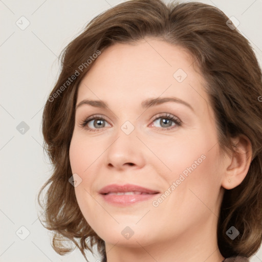 Joyful white young-adult female with medium  brown hair and green eyes