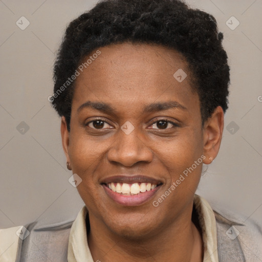 Joyful black young-adult male with short  brown hair and brown eyes