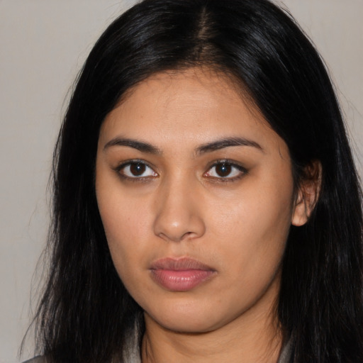 Neutral latino young-adult female with long  brown hair and brown eyes