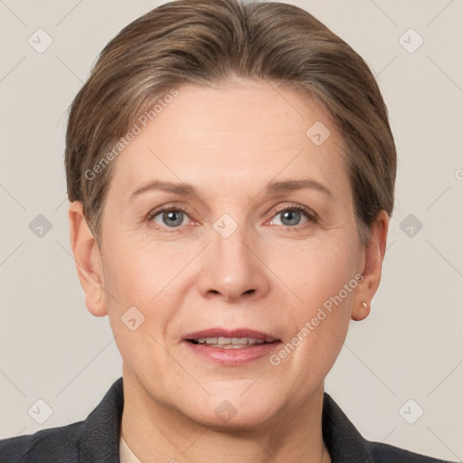 Joyful white adult female with short  brown hair and grey eyes