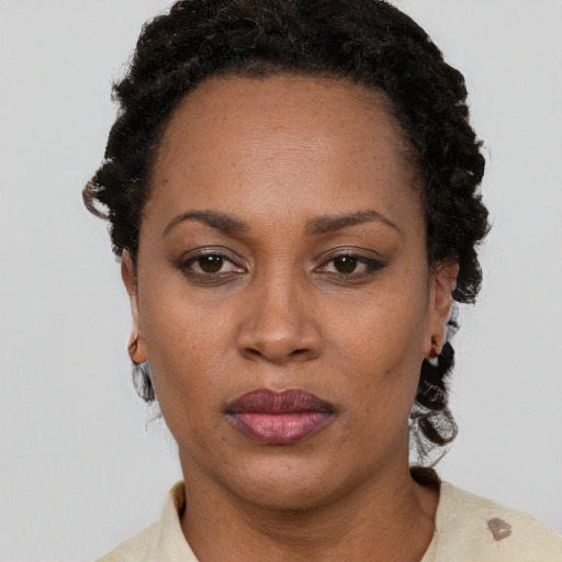 Neutral black adult female with short  black hair and brown eyes