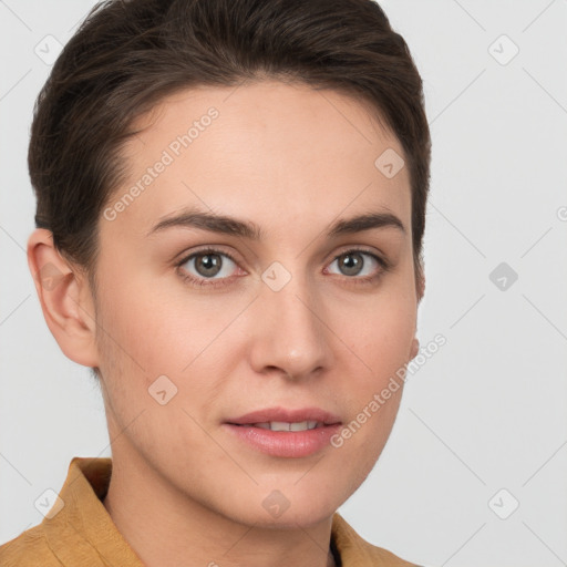 Joyful white young-adult female with short  brown hair and grey eyes