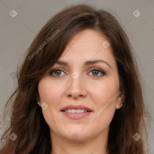 Joyful white adult female with long  brown hair and brown eyes