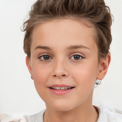 Joyful white child female with short  brown hair and brown eyes