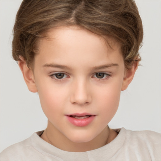 Joyful white child female with short  brown hair and brown eyes