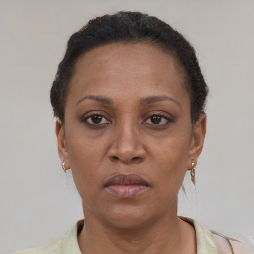Neutral black adult female with short  brown hair and brown eyes