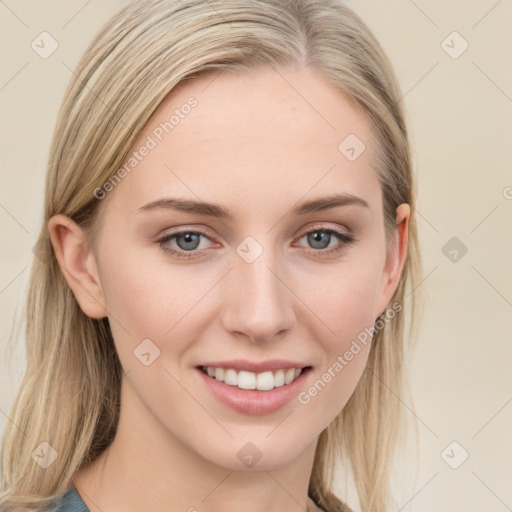 Joyful white young-adult female with long  brown hair and blue eyes