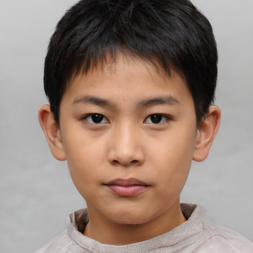 Neutral asian child male with short  brown hair and brown eyes
