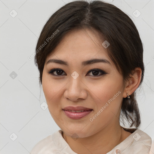 Joyful asian young-adult female with medium  brown hair and brown eyes