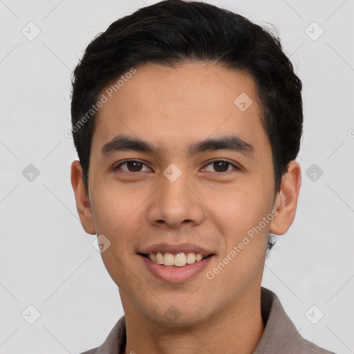 Joyful latino young-adult male with short  black hair and brown eyes