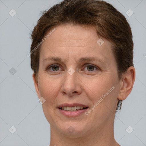 Joyful white adult female with short  brown hair and grey eyes